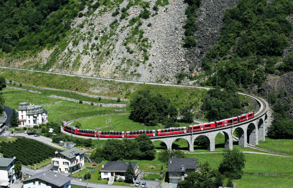 Rhaetian Railway/RhB - The Bernina Express crosses the famous Brusio Circular Viaduct.